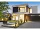 Stunning contemporary home with a sleek design and modern landscaping at 4821 Neal Rdg, Atlanta, GA 30349