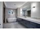 Modern bathroom with freestanding tub and double vanity at 2883 W Roxboro Ne Rd, Atlanta, GA 30324