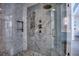 Spa-like shower with marble tile, multiple shower heads, and pebble floor at 2883 W Roxboro Ne Rd, Atlanta, GA 30324