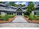 Elegant entryway with stone walkway and lush landscaping at 2883 W Roxboro Ne Rd, Atlanta, GA 30324