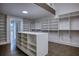Large walk-in closet with custom built-ins and island at 2883 W Roxboro Ne Rd, Atlanta, GA 30324
