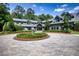 Grand home entrance with circular driveway and landscaping at 2883 W Roxboro Ne Rd, Atlanta, GA 30324