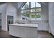 Modern kitchen with white cabinets and large island at 2883 W Roxboro Ne Rd, Atlanta, GA 30324