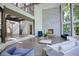 Open living room with soaring ceilings, stone fireplace, and hardwood floors at 2883 W Roxboro Ne Rd, Atlanta, GA 30324