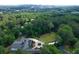 Luxury home with circular driveway and expansive lawn, city in background at 2883 W Roxboro Ne Rd, Atlanta, GA 30324