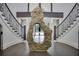 Grand entryway with double staircase and unique stone feature at 2883 W Roxboro Ne Rd, Atlanta, GA 30324