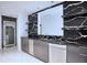 Elegant home bar with black marble countertops and wine fridge at 2883 W Roxboro Ne Rd, Atlanta, GA 30324