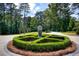 Ornate landscaping highlights the home's grand entrance at 2883 W Roxboro Ne Rd, Atlanta, GA 30324