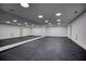 Basement gym featuring mirrored walls and dark flooring at 2883 W Roxboro Ne Rd, Atlanta, GA 30324
