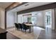 Elegant dining room with concrete table, modern chairs, and hardwood floors at 2883 W Roxboro Ne Rd, Atlanta, GA 30324