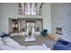 Two-story living room with stone fireplace, hardwood floors, and ample natural light at 2883 W Roxboro Ne Rd, Atlanta, GA 30324