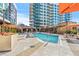 Inviting swimming pool with ample lounge chairs and umbrellas at 40 12Th Ne St # 1005, Atlanta, GA 30309