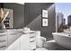 Modern bathroom with freestanding bathtub, city view, and dark gray walls at 40 12Th Ne St # 1005, Atlanta, GA 30309
