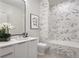 Modern bathroom with marble shower, a floating vanity and a contemporary toilet at 40 12Th Ne St # 1005, Atlanta, GA 30309