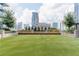 Relaxing outdoor space with artificial turf and benches, offering city views at 40 12Th Ne St # 1005, Atlanta, GA 30309