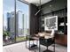 Modern home office with city views and built-in shelving at 40 12Th Ne St # 1005, Atlanta, GA 30309