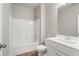 Clean bathroom with a shower/tub combo, vanity with sink, and wood-look tile floor at 29 Riverbirch Ct, Dallas, GA 30157