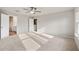 Spacious main bedroom with ceiling fan, carpet, and access to bathroom at 29 Riverbirch Ct, Dallas, GA 30157