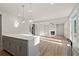 Modern kitchen island overlooking living room at 29 Riverbirch Ct, Dallas, GA 30157