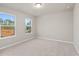 Charming bedroom with neutral carpeting and windows with wooded views at 29 Riverbirch Ct, Dallas, GA 30157