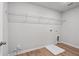 Laundry room with wire shelving, vinyl flooring, and built-in storage at 29 Riverbirch Ct, Dallas, GA 30157