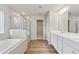 Main bathroom with double vanity, soaking tub, and separate shower at 29 Riverbirch Ct, Dallas, GA 30157