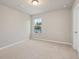 Bright bedroom with carpeted floor and a window at 29 Riverbirch Ct, Dallas, GA 30157