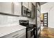 Modern kitchen with gray cabinets, quartz countertops, and stainless steel appliances at 29 Riverbirch Ct, Dallas, GA 30157