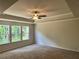Spacious main bedroom with carpeted floors and ceiling fan at 29 Riverbirch Ct, Dallas, GA 30157