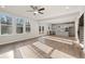 Bright living room features hardwood floors, an open concept layout, and access to the kitchen at 29 Riverbirch Ct, Dallas, GA 30157