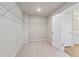 Spacious walk-in closet with wire shelving and carpeted floor at 29 Riverbirch Ct, Dallas, GA 30157