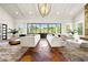 Grand living room with high ceilings, large windows, and ample seating at 29 Riverbirch Ct, Dallas, GA 30157
