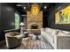 Sophisticated library with dark walls, stone fireplace, and built-in bookshelves at 29 Riverbirch Ct, Dallas, GA 30157