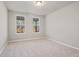 Spacious bedroom with neutral carpeting and large windows offering natural light at 29 Riverbirch Ct, Dallas, GA 30157