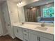 Double vanity bathroom with a soaking tub and walk-in shower at 29 Riverbirch Ct, Dallas, GA 30157