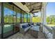 Relaxing covered porch with outdoor seating and ceiling fans at 29 Riverbirch Ct, Dallas, GA 30157