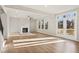 Sunlit living room with fireplace and hardwood floors at 29 Riverbirch Ct, Dallas, GA 30157