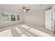 Main bedroom with ceiling fan, neutral carpet, and ample natural light at 29 Riverbirch Ct, Dallas, GA 30157