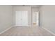 Well-lit bedroom with plush carpeting and double-door closet at 29 Riverbirch Ct, Dallas, GA 30157