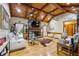 Living room with hardwood floors, stone fireplace, and vaulted ceiling at 26 David Nw Rd, Cartersville, GA 30121