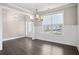 Formal dining room with hardwood floors and wainscoting at 6035 Spring Way, Stonecrest, GA 30038