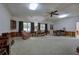Spacious Gathering room featuring a brick fireplace and wood paneling at 45 Latimer Nw Ln, Cartersville, GA 30121