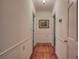 Long hallway with hardwood floors and access to other rooms at 45 Latimer Nw Ln, Cartersville, GA 30121