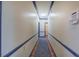 Long hallway with blue trim and wood floors at 45 Latimer Nw Ln, Cartersville, GA 30121