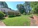 Large backyard with green grass and home view at 45 Latimer Nw Ln, Cartersville, GA 30121