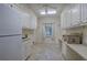 Bright laundry room featuring ample cabinetry and counter space at 45 Latimer Nw Ln, Cartersville, GA 30121
