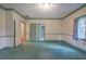 Bright bedroom with carpet, window, and access to bathroom at 45 Latimer Nw Ln, Cartersville, GA 30121