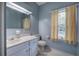 Bathroom with toilet, vanity, and window offering natural light at 45 Latimer Nw Ln, Cartersville, GA 30121