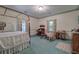 Bedroom with canopy bed, carpet, and built-in desk at 45 Latimer Nw Ln, Cartersville, GA 30121