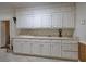 Kitchen with white cabinets and extensive counter space at 45 Latimer Nw Ln, Cartersville, GA 30121